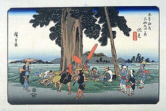 歌川広重「木曽海道六十九次」の「伏見」。街道と旅人を描いた浮世絵。